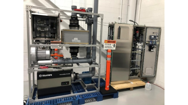 Figure 1: A portion of the VHP Decontamination System at STERIS before shipment. Shown are the accessory skid (left) and the generator (right). 